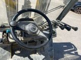 a close up of a steering wheel on a forklift