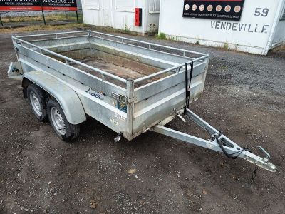 a trailer that is parked in the dirt
