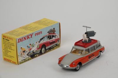a toy car and a box on a white surface