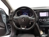 the interior of a car with a steering wheel and dashboard controls