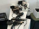 several hair dryers are sitting on a table in a room
