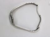 an image of a silver bracelet on a white surface