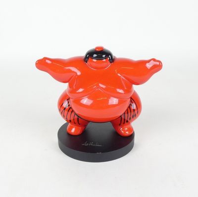 figurine of a fat man in a red suit