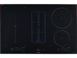 a close up of a black stove top with three burners