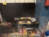 an image of a dirty stove in a dirty kitchen