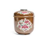 an image of a brown jar with a floral design on it
