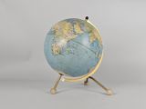 an image of a small globe on a stand with a white background