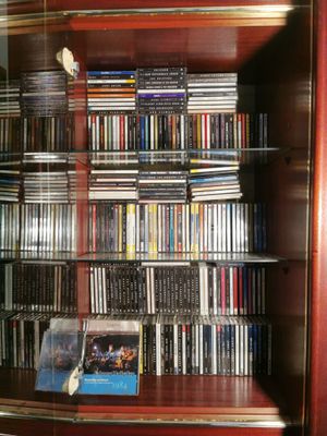 a glass display case with many dvds in it