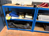 a blue shelf with a bunch of items on top of it