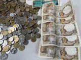 a lot of coins and a picture of a woman on it