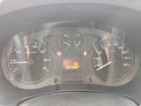 a close up of a car dashboard with a clock on it