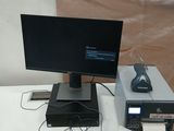 a desk with a computer, keyboard, mouse and monitor on it