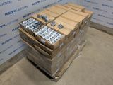 a stack of boxes with a lot of metal parts on top of it