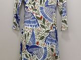 a blue and white dress with a bird pattern on it
