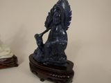 two figurines of a lion and a dog on a table