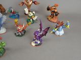 many figurines of different types and sizes on the table