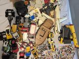 a pile of toys and other items on a bed