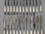 an assortment of silverware including forks, knives and spoons