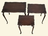 a set of three small tables with wooden tops and legs