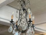 a chandelier hanging from the ceiling in a room