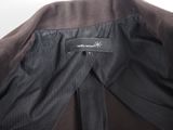 a close up of a black jacket with a label on it