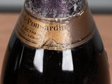 a close up of a bottle of wine on a table