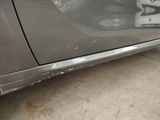 a close up of a car door with a sticker on it