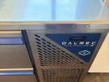 a stainless steel counter with a blue drawer underneath it