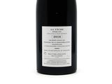 a bottle of wine that is sitting on a table
