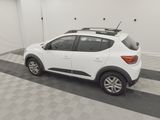 the white car is parked in the garage on the checkered floor