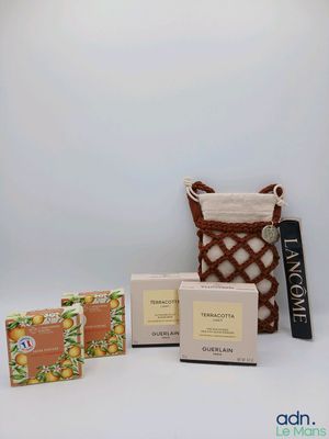 an assortment of soaps, soap bars and soap bars in a basket on a white background