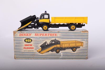a toy truck with a snow plow on top of it