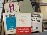 many books that are in a box on the table