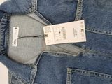 the back of a pair of blue jeans with a tag on it