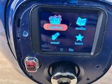 a close up of a blue motorcycle with a clock on it