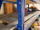 a blue shelf with a bunch of tools on top of it