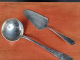 two spoons and a spatula sitting on a table