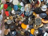 many different types of buttons on a table