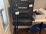 a camera on a tripod in the corner of a room