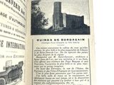 an open book with a picture of a building in the background