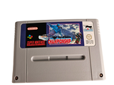 a nintendo game on a white surface with a sticker on it