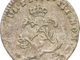 a close up of a coin with a crown on it
