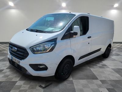 a white ford transit van parked in a room with a checkered floor