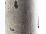 a close up of a bottle of red wine with a peeling label