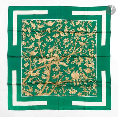a green and gold square scarf with birds and flowers on it
