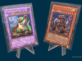 two cards that are on display on a stand