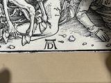a drawing of a man riding a horse with a skull on it