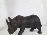 an image of a rhino figurine on a white background