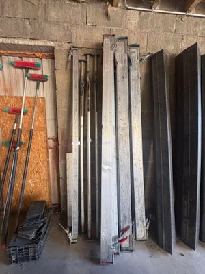 several pieces of metal are stacked up in a garage