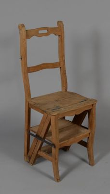 a small wooden chair with a ladder on the back
